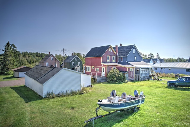 52 Senter St, Ahmeek, MI 49901 - view of green lawn with an outdoor structure