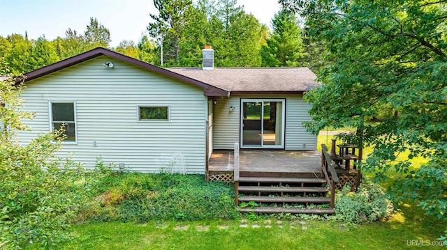 back of property featuring a deck