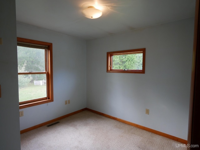 empty room with carpet flooring