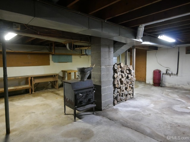 basement featuring a wood stove