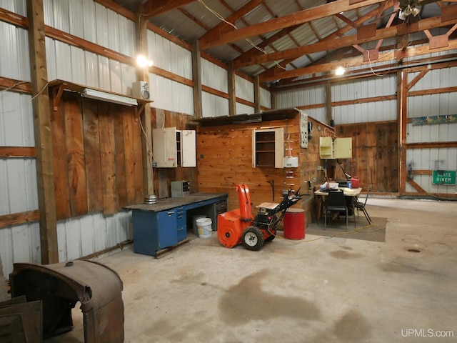 garage featuring wooden walls