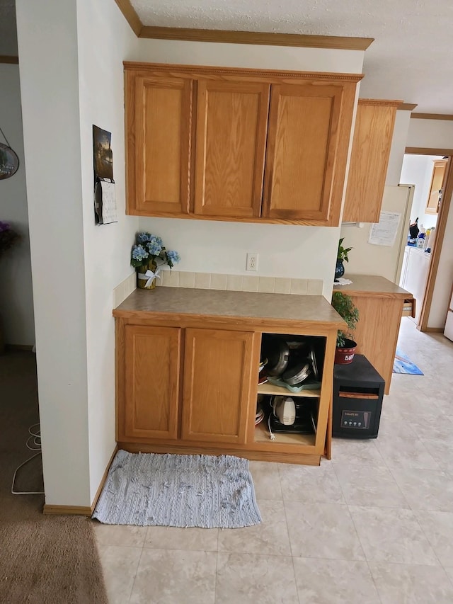 kitchen featuring crown molding