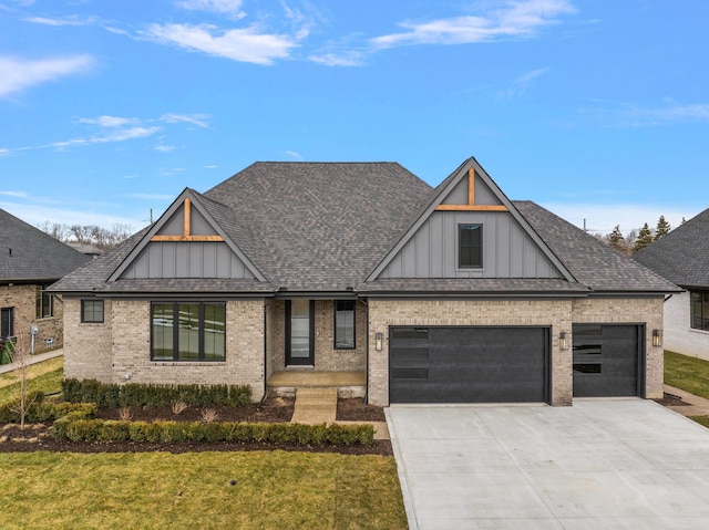 view of front of home featuring a garage and a front yard