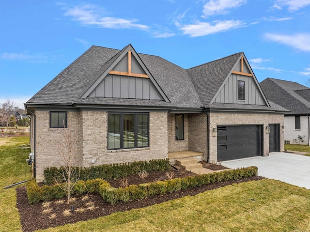 view of front of property featuring a garage and a front lawn