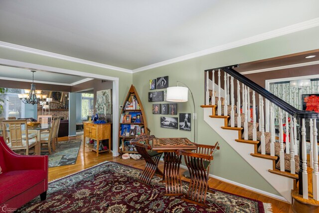 interior space featuring crown molding and hardwood / wood-style floors