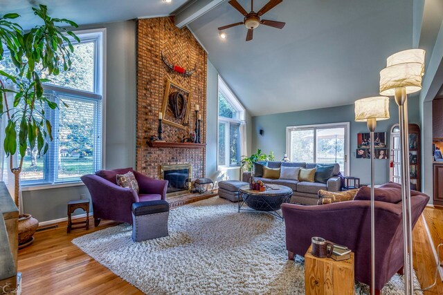 living room with an inviting chandelier, hardwood / wood-style flooring, and ornamental molding