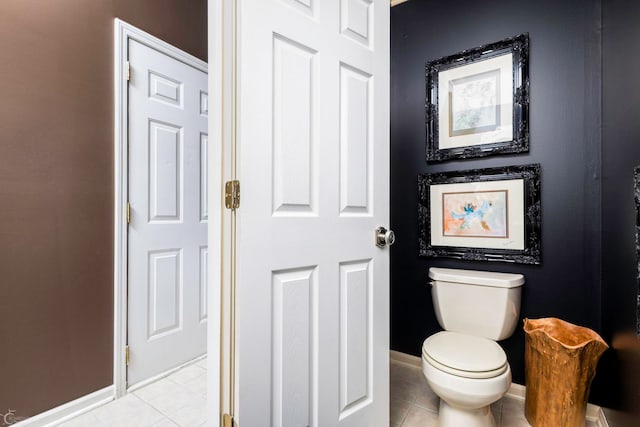 bathroom featuring tile patterned flooring and toilet