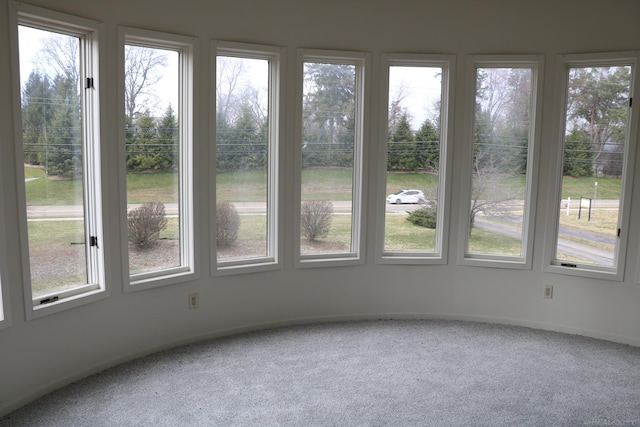 unfurnished sunroom featuring plenty of natural light