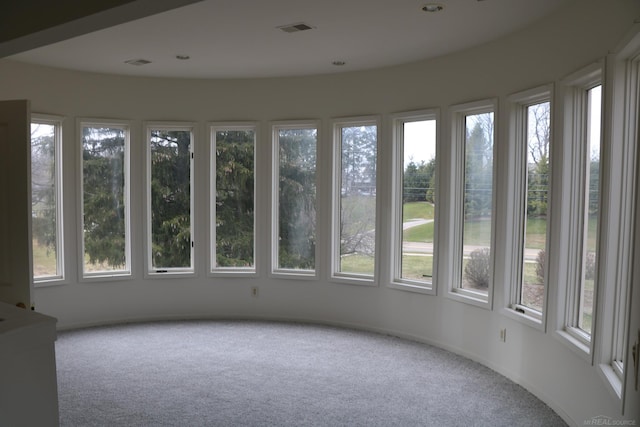 unfurnished sunroom featuring plenty of natural light