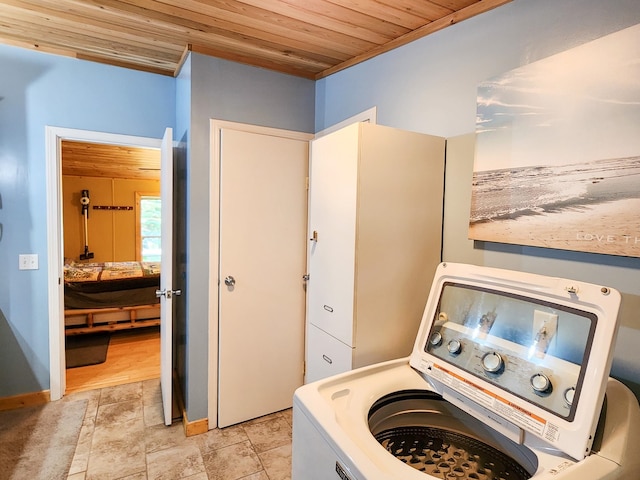 laundry room with wood ceiling and washer / clothes dryer