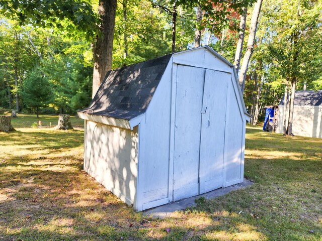 view of outdoor structure with a lawn