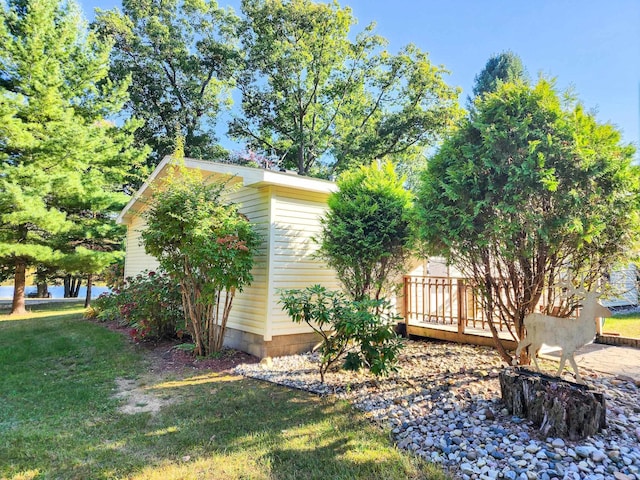 view of property exterior featuring a lawn