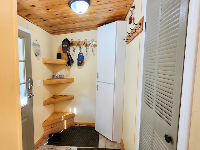 mudroom featuring wood ceiling and light tile patterned floors