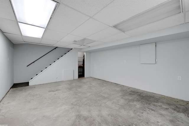 basement featuring a paneled ceiling