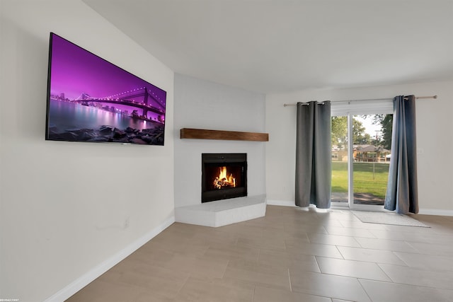 unfurnished living room with light tile patterned flooring