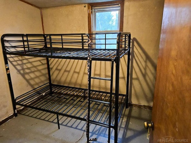 bedroom featuring concrete floors