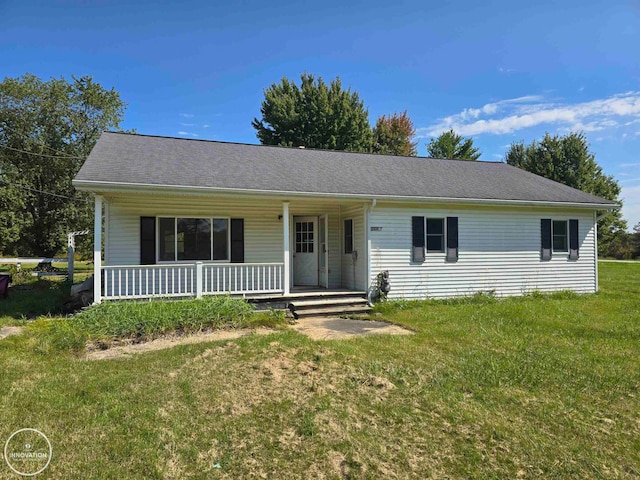 ranch-style house with a front yard and covered porch