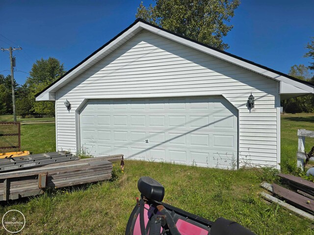 garage with a lawn