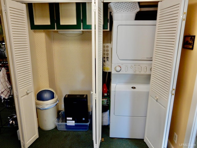 laundry area with stacked washer and dryer