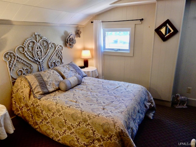 carpeted bedroom with vaulted ceiling