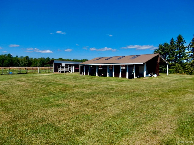 exterior space featuring a rural view and an outdoor structure