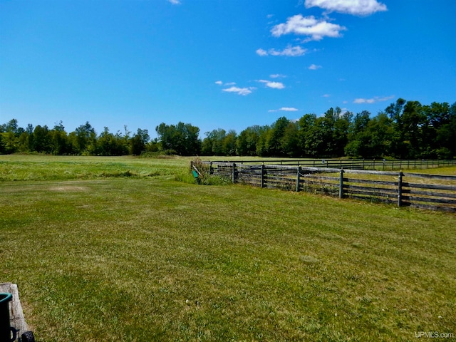 view of yard with a rural view