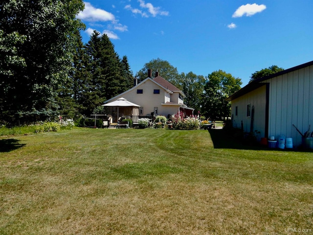 view of yard featuring a deck