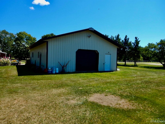 view of outbuilding with a lawn