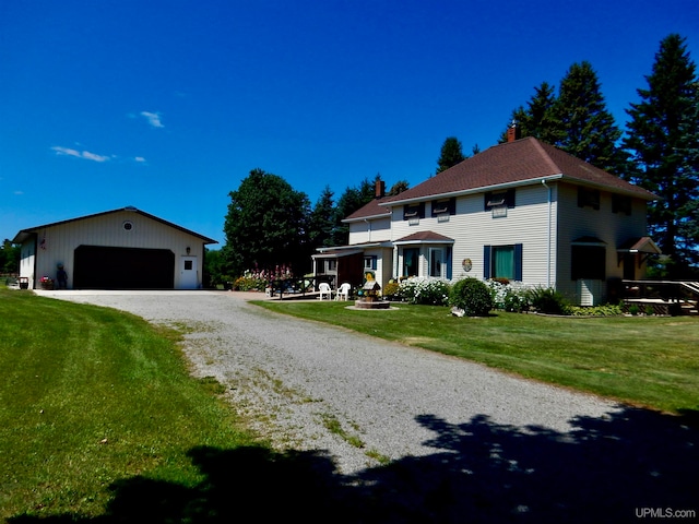 view of front of property with a garage and a front yard