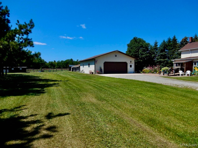 exterior space featuring an outbuilding and a garage