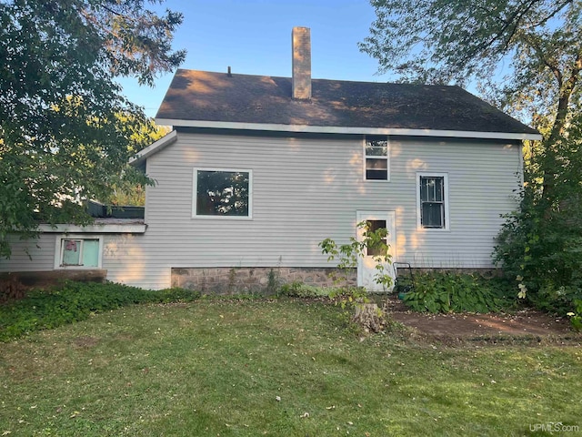 view of side of home featuring a lawn