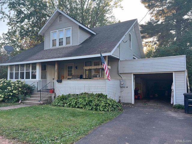 view of front of home with a porch and a garage