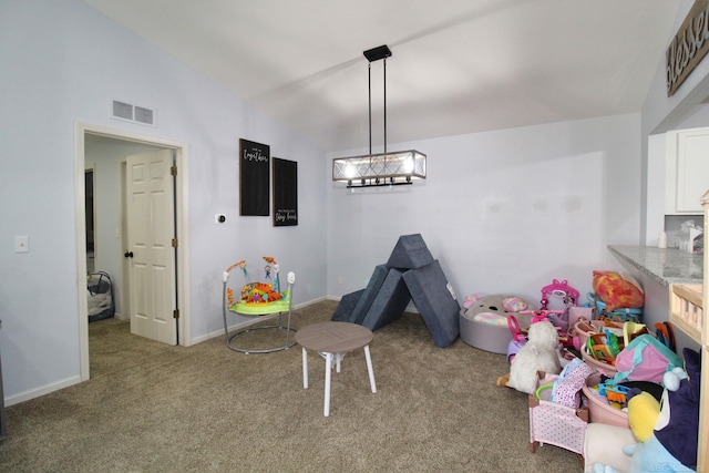 recreation room featuring vaulted ceiling and carpet floors