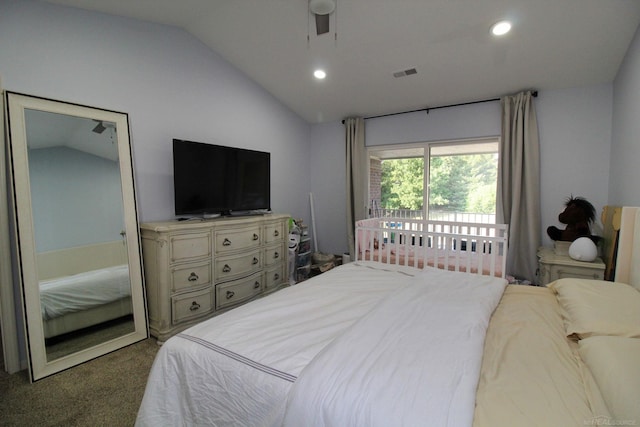 bedroom with lofted ceiling, dark colored carpet, and ceiling fan