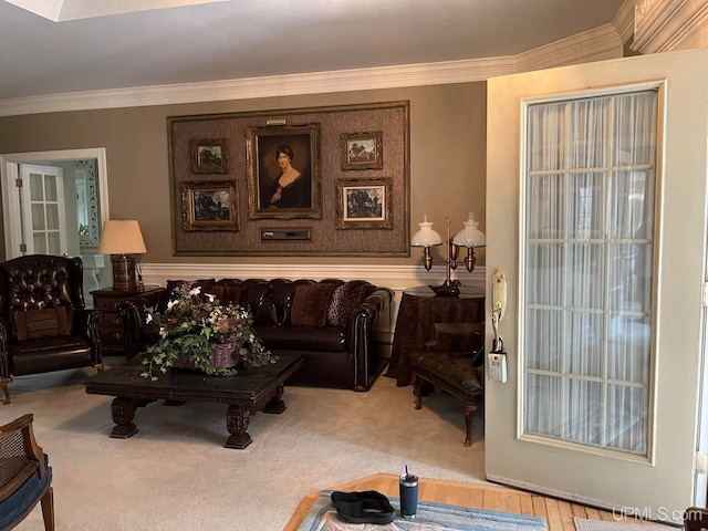 living room with carpet floors and ornamental molding