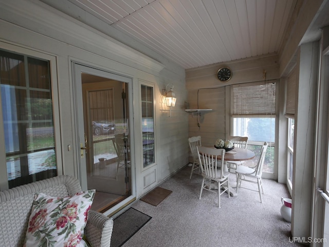 sunroom / solarium featuring wooden ceiling