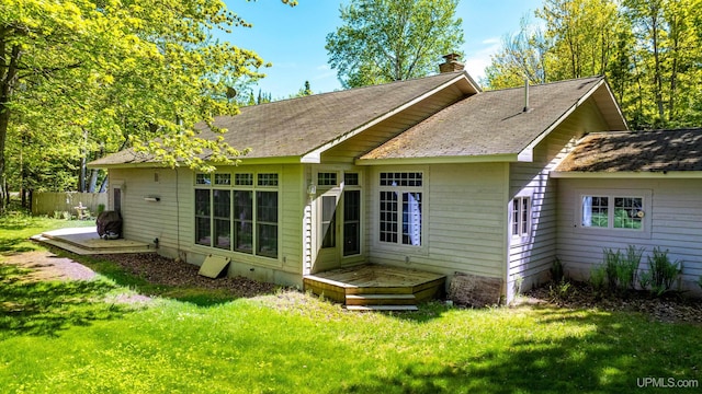 rear view of house with a lawn