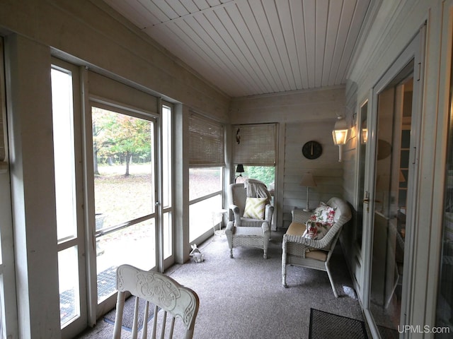 sunroom / solarium featuring wooden ceiling