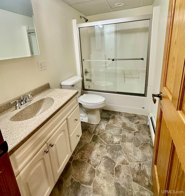 full bathroom with a baseboard radiator, shower / bath combination with glass door, vanity, and toilet