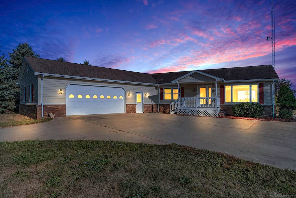 view of front of property featuring a garage and covered porch