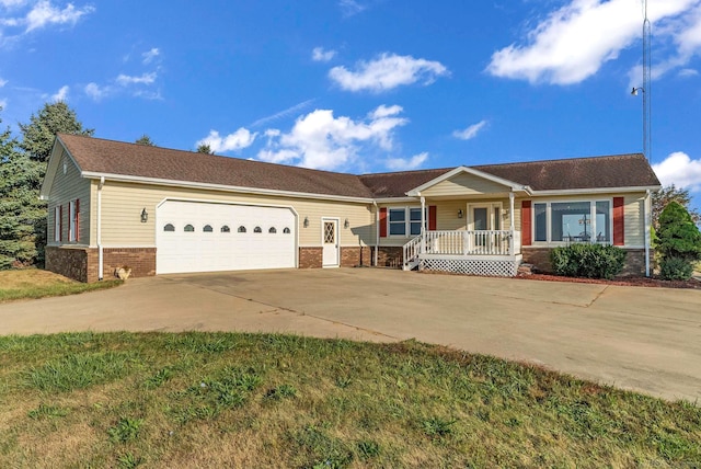 ranch-style house featuring a garage and a porch