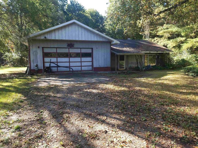 garage featuring a yard