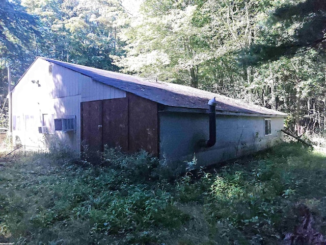 view of side of property featuring cooling unit