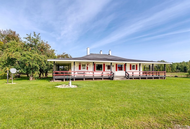 back of house with a wooden deck and a yard