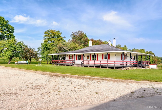 view of home's community featuring a wooden deck and a lawn