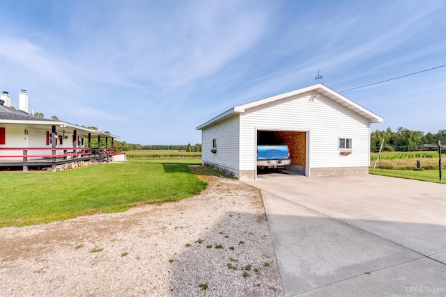 view of outdoor structure with a lawn and a garage