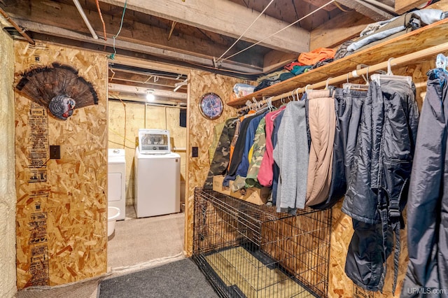 basement with carpet flooring and washer and clothes dryer