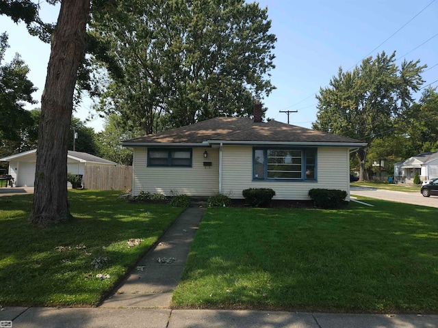 ranch-style home with a front lawn