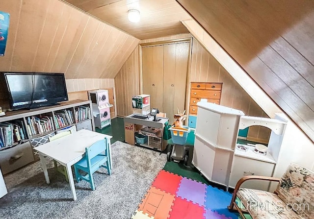 bonus room with wooden walls, lofted ceiling, carpet, and wooden ceiling