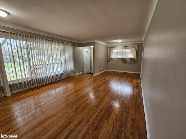 unfurnished living room with hardwood / wood-style floors